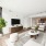 Living room with view into kitchen