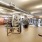 spacious, fitness center with exposed piping and bright lighting