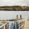 two people taking a picture on a pier