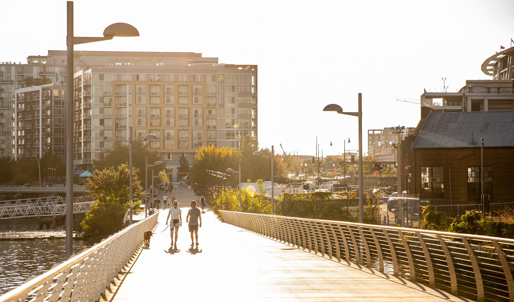 Modern Conveniences couple walking their dog down Capitol Riverfront